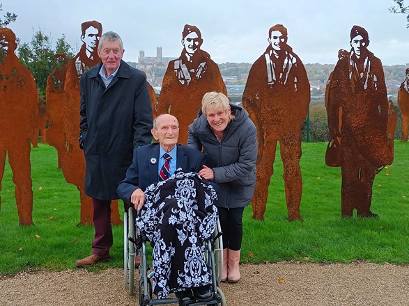 Clifford seen in front of memorial artwork